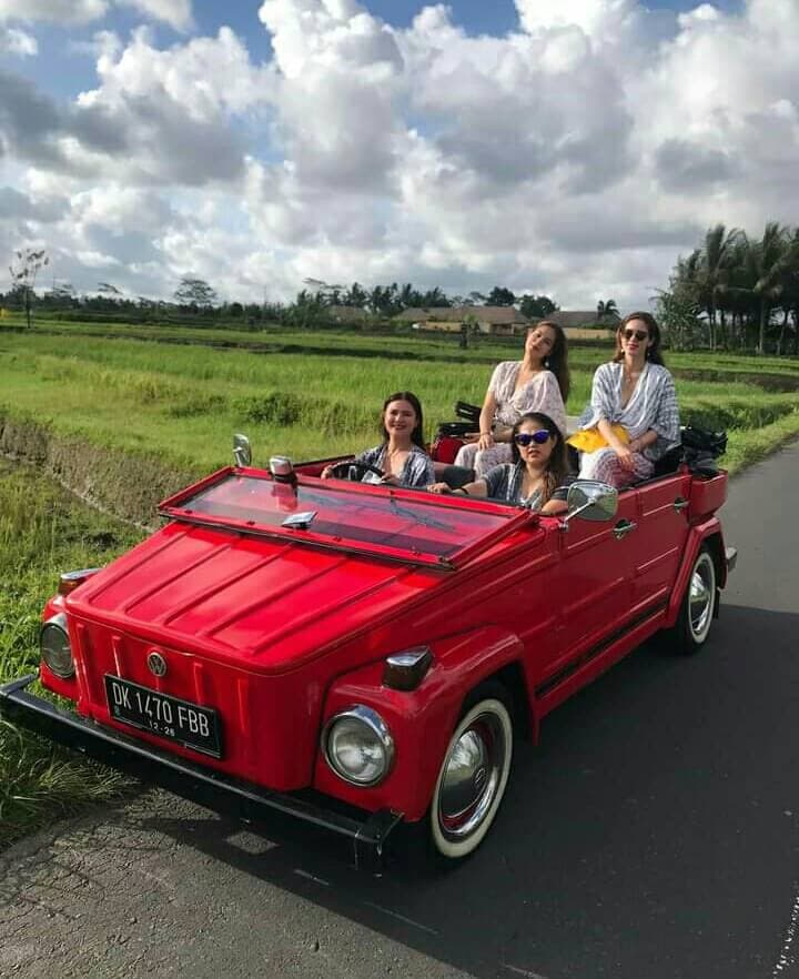 Friends from Melbourne catching golden hour on the way back from Tanah Lot.